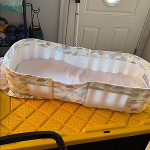 White and Blue Baby Travel Bed